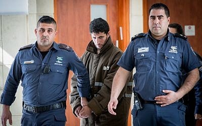 Arafat Irfaiya, charged with the rape and murder of 19-year-old Ori Ansbacher is brought for a hearing at the Jerusalem District court, on March 7, 2019. (Yonatan Sindel/Flash90)