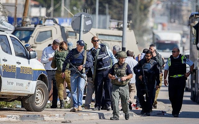 Illustrative: Israeli security forces at the scene of an alleged attempted stabbing attack at the Hawara checkpoint, south of the West Bank city of Nablus, April 3, 2019. (Nasser Ishtayeh/Flash90) Illustrative: Israeli security forces at the scene of an alleged attempted stabbing attack at the Hawara checkpoint, south of the West Bank city of Nablus, April 3, 2019. (Nasser Ishtayeh/Flash90)