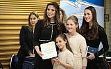 Blue and White MK Omer Yankelevich poses for a photo with her family ahead of the swearing-in of the 21st Knesset on April 30, 2019. (Noam Revkin Fenton/Flash90)