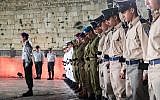 IDF soldiers stand still as the memorial siren sounds during the ceremony marking Memorial Day for Israel's fallen soldiers and victims of terror, at the Western Wall in Jerusalem's Old City, on May 7, 2019. (Noam Revkin Fenton/Flash90)