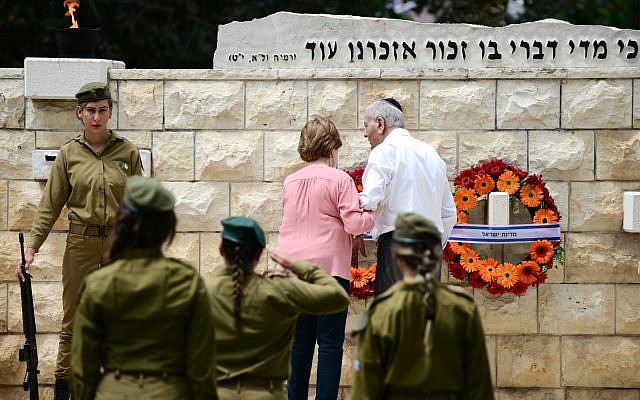 Israeli soldiers participate in an official Memorial Day ceremony in the Nahalat Yitshak Cemetery, Tel Aviv on May 8, 2019. (Tomer Neuberg/FLASH90 Israeli soldiers participate in an official Memorial Day ceremony in the Nahalat Yitshak Cemetery, Tel Aviv on May 8, 2019. (Tomer Neuberg/FLASH90