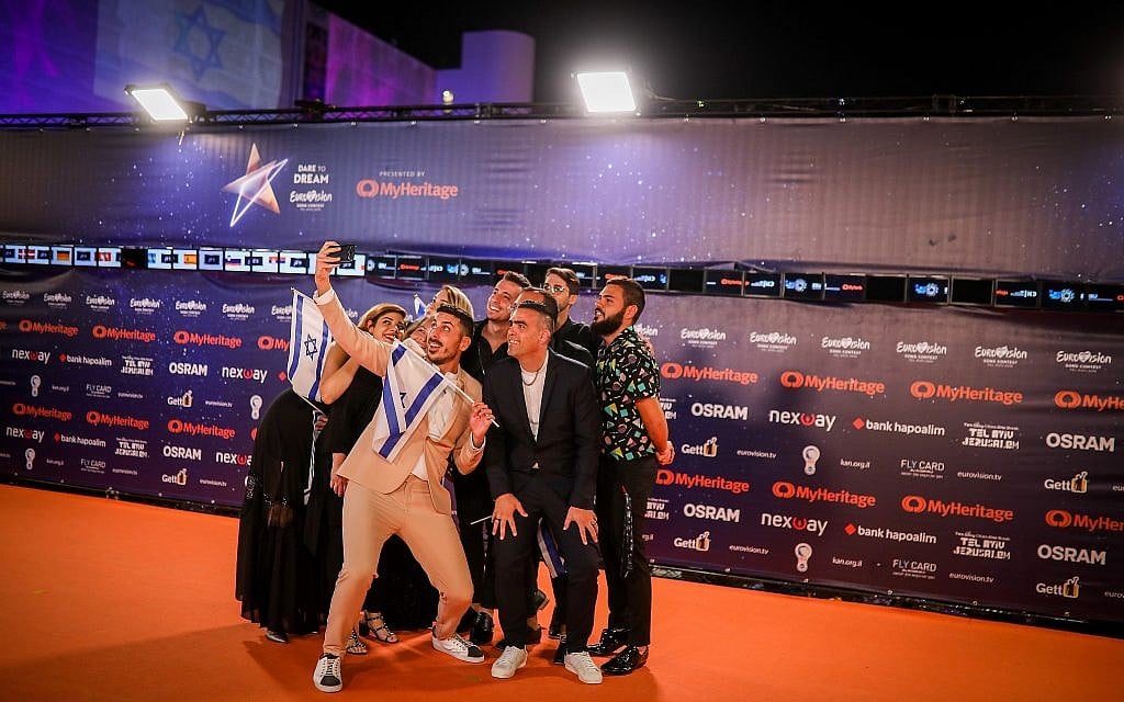 Israeli contestant Kobi Marimi walks on the Orange Carpet, during the opening event of the 2019 Eurovision Song Contest, at Habima Square in Tel Aviv on May 12, 2019. (Hadas Parush/Flash90)