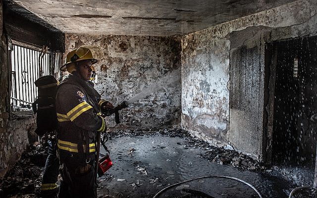 Firefighters at the scene of a fire in an apartment in the northern city of Safed, May 25, 2019 (Basel Awidat/Flash90) Firefighters at the scene of a fire in an apartment in the northern city of Safed, May 25, 2019 (Basel Awidat/Flash90)