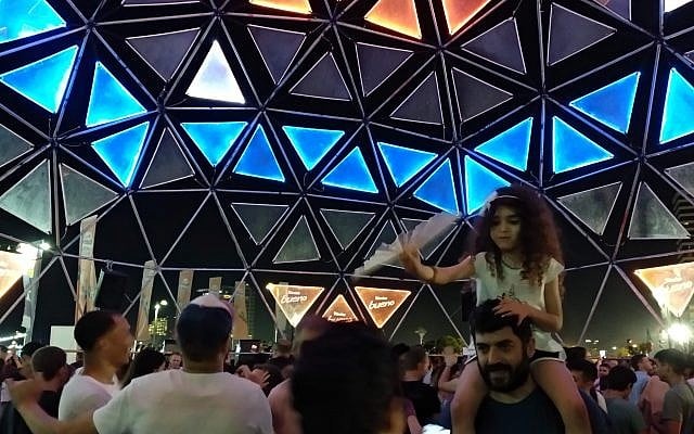 People dance in one of the many DJ spots at the Eurovision Village in Tel Aviv's Charles Clore Park on May 16, 2019. (Melanie Lidman/Times of Israel) People dance in one of the many DJ spots at the Eurovision Village in Tel Aviv's Charles Clore Park on May 16, 2019. (Melanie Lidman/Times of Israel)