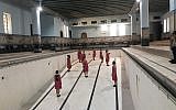 A rehearsal of one of the dances in 'Body -- Dance -- Place' at the historic, now empty, YMCA pool in Jerusalem (Jessica Steinberg/Times of Israel)