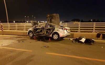 Wreckage of a car after a suspected mob-related bombing in Hadera, May 15, 2019 (Israel Police)