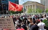 Counter demonstrators against a KKK rally in Dayton, Ohio gather behind a security fence at Courthouse Square in the city's downtown on May 25, 2019.(Matthew Hatcher/Getty Images via JTA)