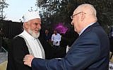 President Reuven Rivlin (right) with an Arab leader at an Iftar dinner, May 28, 2019 (Mark Neiman/GPO)