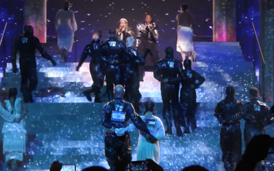 Madonna and Quavo sing "Future" at the Eurovision Song Contest as two dancers walk arm-in-arm with Israeli and Palestinian flags on their backs, May 18, 2019 (YouTube screenshot)