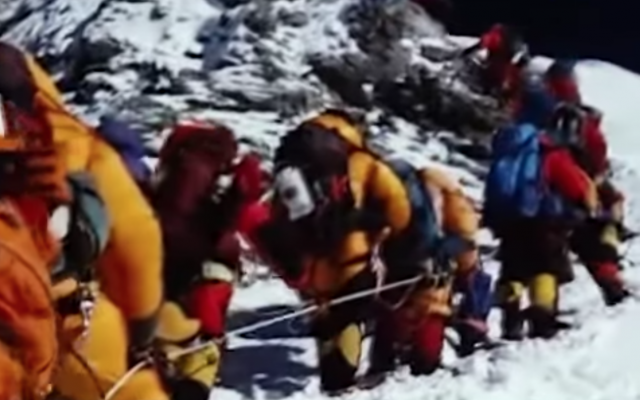 Climbers in a line headed to the summit of Mount Everest, May 2019 (YouTube screenshot) Climbers in a line headed to the summit of Mount Everest, May 2019 (YouTube screenshot)
