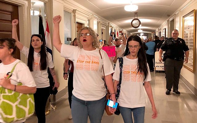 Protesters march through the halls of the Missouri Capitol outside the House chamber on May 17, 2019, in Jefferson City, Missouri, in opposition to legislation prohibiting abortions at eight weeks of pregnancy. (AP Photo/David A. Lieb) Protesters march through the halls of the Missouri Capitol outside the House chamber on May 17, 2019, in Jefferson City, Missouri, in opposition to legislation prohibiting abortions at eight weeks of pregnancy. (AP Photo/David A. Lieb)