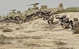 In this undated photo released by Saudi Press Agency, SPA, Saudi military personnel conduct military exercises dubbed Gulf Shield One in Saudi Arabia. (Saudi Press Agency via AP)