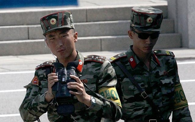 North Korean soldiers look at the South side at the border village of Panmunjom in the Demilitarized Zone, South Korea, May 1, 2019. (AP Photo/Lee Jin-man) North Korean soldiers look at the South side at the border village of Panmunjom in the Demilitarized Zone, South Korea, May 1, 2019. (AP Photo/Lee Jin-man)