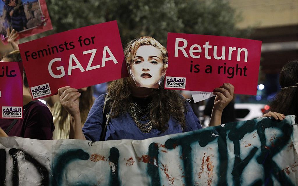 A demonstrator wearing a mask, bearing the likeness of American singer Madonna, during a protest calling for a boycott of the 2019 Eurovision Song Contest in Tel Aviv, May 18, 2019. (Ahmad GHARABLI/AFP)
