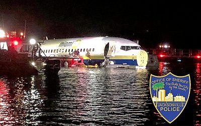 In this photo released by the Jacksonville Sheriff's Office, authorities work at the scene of a plane in the water in Jacksonville, Florida, May 3, 2019.(Jacksonville Sheriff's Office via AP)