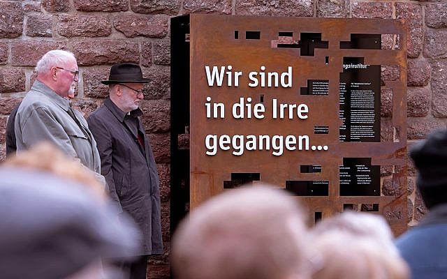 People stand around an installation during the official inauguration of a memorial in remembrance of the Institute for the Study and Elimination of Jewish Influence on German Church Life during the Third Reich in Eisenach, Germany, May 6, 2019. The words on the memorial read: 'We have gone astray'. (AP Photo/Jens Meyer) People stand around an installation during the official inauguration of a memorial in remembrance of the Institute for the Study and Elimination of Jewish Influence on German Church Life during the Third Reich in Eisenach, Germany, May 6, 2019. The words on the memorial read: 'We have gone astray'. (AP Photo/Jens Meyer)