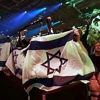 Spectators watch the 2019 Eurovision Song Contest grand final in Tel Aviv, May 18, 2019. (AP Photo/Sebastian Scheiner)