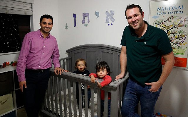Elad Dvash-Banks, left, and his partner, Andrew, pose for photos with their twin sons, Ethan, center right, and Aiden in their apartment in Los Angeles, January 23, 2018 (AP Photo/Jae C. Hong, File) Elad Dvash-Banks, left, and his partner, Andrew, pose for photos with their twin sons, Ethan, center right, and Aiden in their apartment in Los Angeles, January 23, 2018 (AP Photo/Jae C. Hong, File)