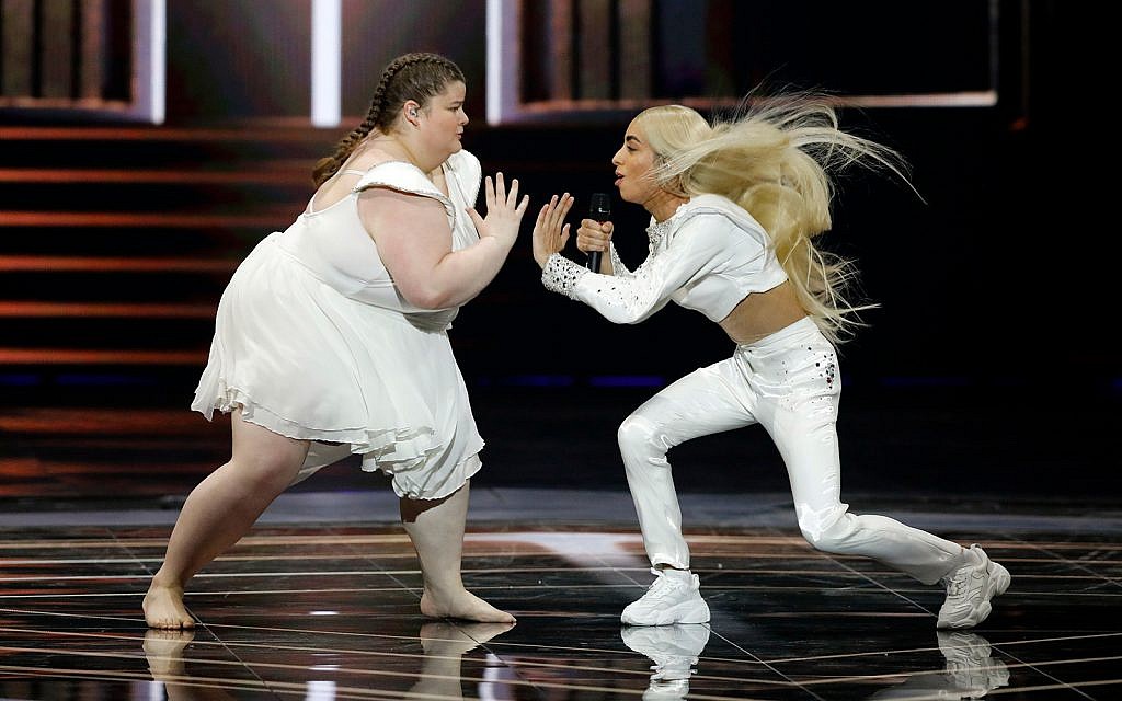 Bilal Hassani of France, right, performs the song "Roi" during the 2019 Eurovision Song Contest grand final in Tel Aviv, May 18, 2019. (AP Photo/Sebastian Scheiner)