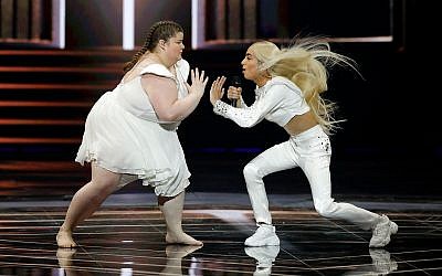 Bilal Hassani of France, right, performs the song "Roi" during the 2019 Eurovision Song Contest grand final in Tel Aviv, May 18, 2019. (AP Photo/Sebastian Scheiner)