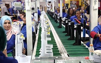 Employees on an assembly line in SodaStream's Rahat factory on May 27, 2019. (courtesy SodaStream)