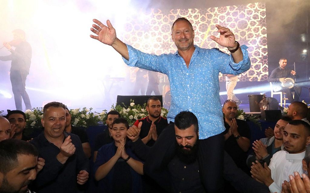 SodaStream CEO Daniel Birnbaum dances with employees during a Ramadan iftar breakfast at the Rahat factory on May 27, 2019. (courtesy SodaStream) SodaStream CEO Daniel Birnbaum dances with employees during a Ramadan iftar breakfast at the Rahat factory on May 27, 2019. (courtesy SodaStream)
