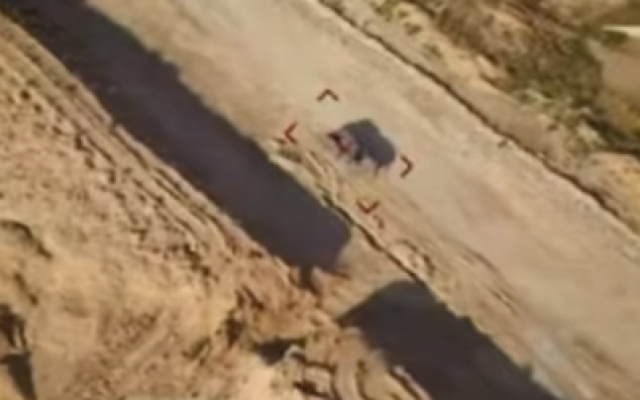 An image from footage released by Palestinian Islamic Jihad on May 30, 2019 purporting to be filmed from a drone dropping incendiary bombs on an IDF tank. (Screen capture: Facebook)