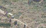 Rescuers on a hillside near Kibbutz Heftsiba in northern Israel on May 4, 2019 after an ATV accident that left three dead and one seriously hurt. (Channel 12 screen capture)