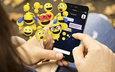 Illustrative - Emoji use on a smartphone. (Mlindri, Getty Images)