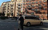 A haredi Orthodox man crosses the street in Williamsburg, Brooklyn. (Gil Shefler via JTA)