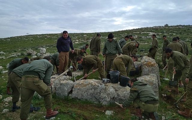 In this photo released by the Israel Antiquities Authority on June 19, 2019, soldiers from the Paratroopers Brigade take part in an archaeological dig at their base in southern Israel. (Israel Antiquities Authority)