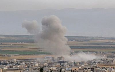 Smoke billows following reported Syrian government forces' bombardment on the town of Khan Sheikhun in the southern countryside of the jihadist-held Idlib province, on June 1, 2019. ( Anas AL-dyab / AFP)