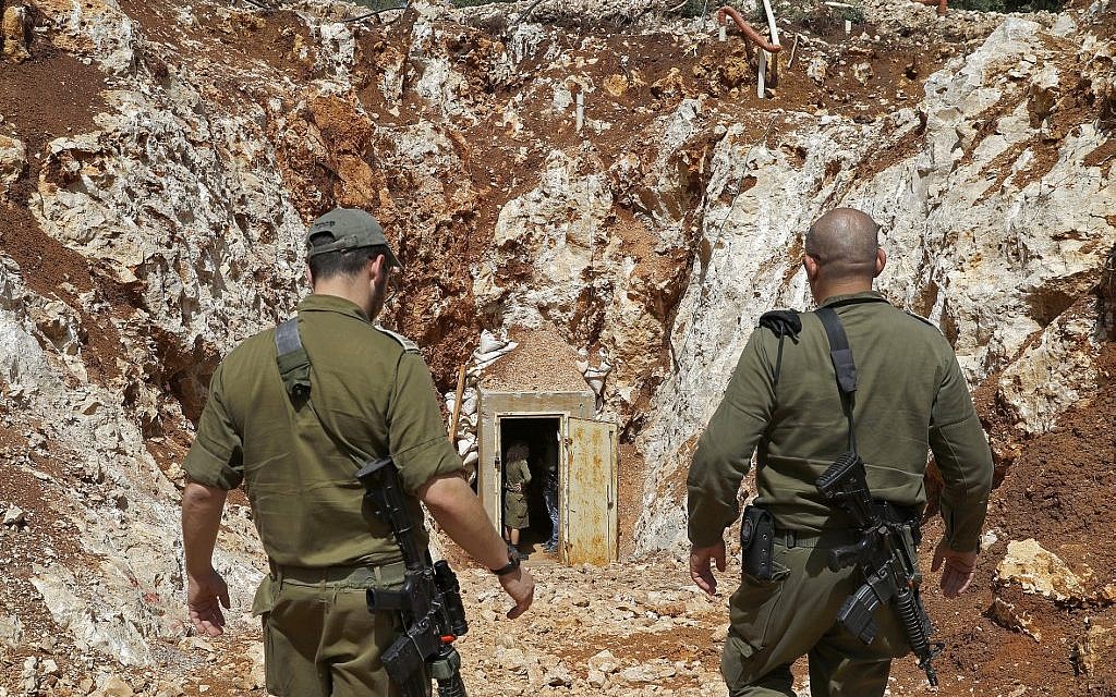 A picture taken on June 3, 2019, during a guided tour with the IDF shows soldiers walking near the entrance to a tunnel at the Israeli side of the border with Lebanon.  (Jack Guez/AFP)