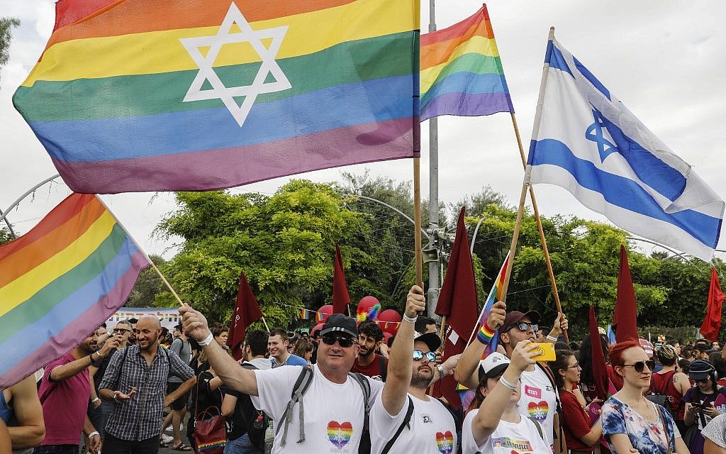 People take part in the 18th annual Jerusalem Gay Pride parade on June 6, 2019. (Menahem Kahana/AFP) People take part in the 18th annual Jerusalem Gay Pride parade on June 6, 2019. (Menahem Kahana/AFP)
