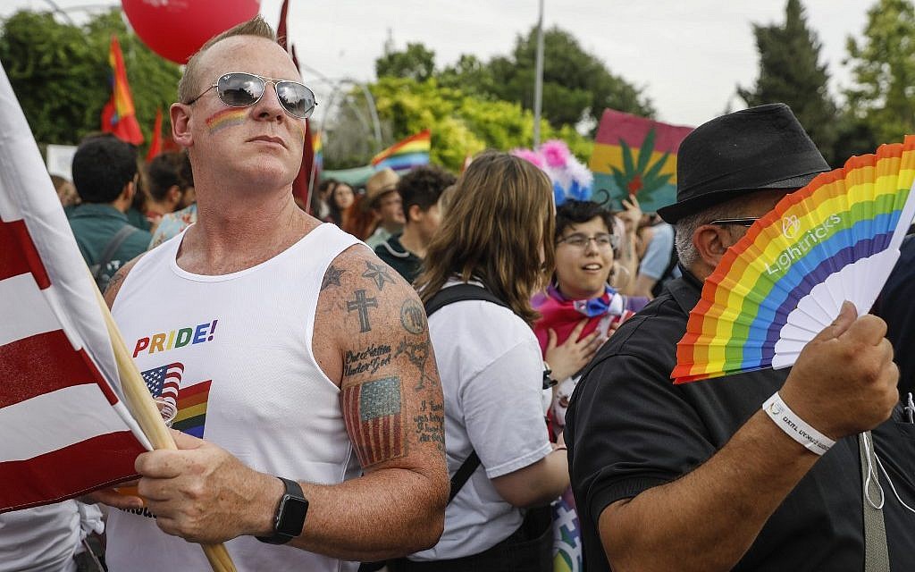 People take part in the 18th annual Jerusalem Gay Pride parade on June 6, 2019. (Menahem Kahana/AFP) People take part in the 18th annual Jerusalem Gay Pride parade on June 6, 2019. (Menahem Kahana/AFP)
