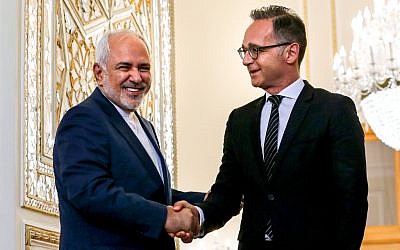 Iran's Foreign Minister Mohammad Javad Zarif (L) receives his German counterpart Heiko Maas in the capital Tehran on June 10, 2019. (Photo by ATTA KENARE / AFP)