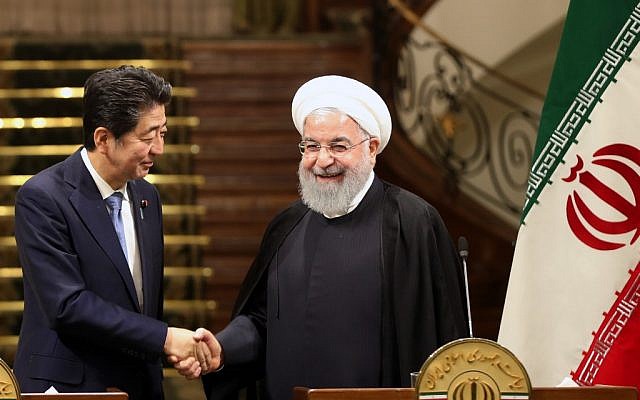 Iranian President Hassan Rouhani (R) shakes hands with Japanese Prime Minister Shinzo Abe at the Saadabad Palace in Iran's capital Tehran on June 12, 2019. (AFP) Iranian President Hassan Rouhani (R) shakes hands with Japanese Prime Minister Shinzo Abe at the Saadabad Palace in Iran's capital Tehran on June 12, 2019. (AFP)