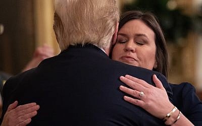 Outgoing White House Press Secretary Sarah Huckabee Sanders hugs US President Donald Trump in the East Room of the White House in Washington, DC, June 13, 2019 (SAUL LOEB / AFP)