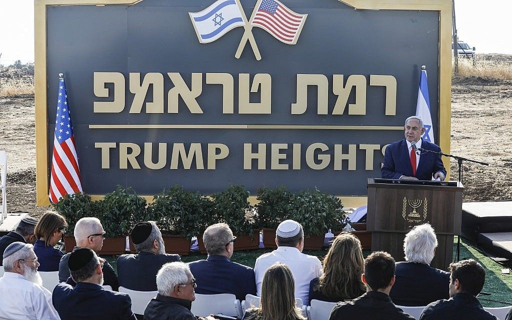 Prime Minister Benjamin Netanyahu gives a speech before the newly-unveiled sign for the new settlement of 'Ramat Trump,' or 'Trump Heights' in English, named after the US President during an official ceremony in the Golan Heights on June 16, 2019. (Jalaa MAREY/AFP)