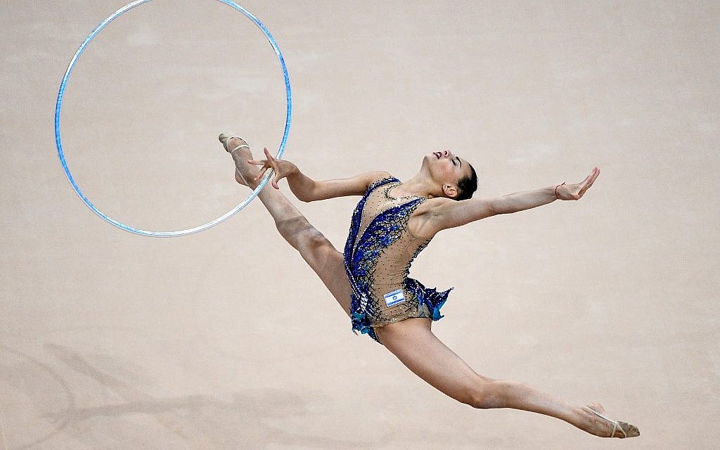 Linoy Ashram competes in the hoop event of the rhythmic gymnastics individual final at the 2019 European Games in Minsk on June 23, 2019. (Kirill KUDRYAVTSEV / AFP) Linoy Ashram competes in the hoop event of the rhythmic gymnastics individual final at the 2019 European Games in Minsk on June 23, 2019. (Kirill KUDRYAVTSEV / AFP)