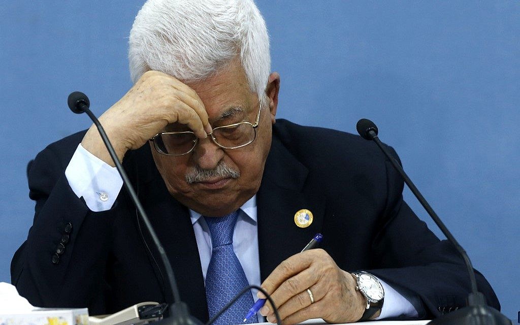 Palestinian Authority President Mahmoud Abbas takes notes during a meeting with journalists in the West Bank town of Ramallah on June 23, 2019. (ABBAS MOMANI / AFP) Palestinian Authority President Mahmoud Abbas takes notes during a meeting with journalists in the West Bank town of Ramallah on June 23, 2019. (ABBAS MOMANI / AFP)