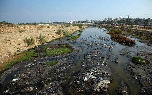 Raw sewage flows near the main Gaza Strip power plant serving the Hamas-run Palestinian territory, south of Gaza City, on June 24, 2019. (Photo by MOHAMMED ABED / AFP) Raw sewage flows near the main Gaza Strip power plant serving the Hamas-run Palestinian territory, south of Gaza City, on June 24, 2019. (Photo by MOHAMMED ABED / AFP)