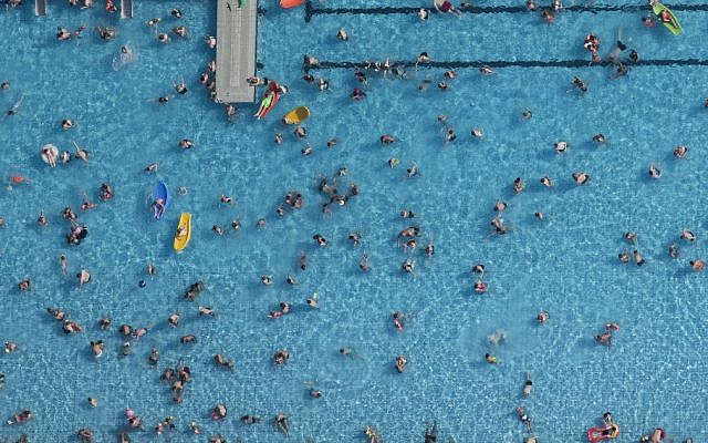 People cool off at a open-air swimming pool in Haltern am See, western Germany on June 26, 2019 as temperatures topped 38 degrees Celsius. (INA FASSBENDER / AFP)