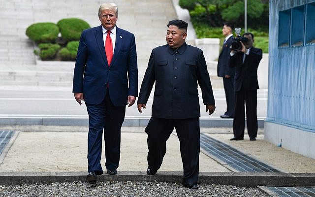 North Korea's leader Kim Jong Un (right) and US President Donald Trump cross south of the Military Demarcation Line that divides North and South Korea, after Trump briefly stepped over to the northern side, in the Joint Security Area (JSA) of Panmunjom in the Demilitarized zone (DMZ) on June 30, 2019. (Brendan Smialowski / AFP) North Korea's leader Kim Jong Un (right) and US President Donald Trump cross south of the Military Demarcation Line that divides North and South Korea, after Trump briefly stepped over to the northern side, in the Joint Security Area (JSA) of Panmunjom in the Demilitarized zone (DMZ) on June 30, 2019. (Brendan Smialowski / AFP)