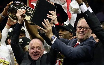 Larry Tanenbaum (L) holds the Larry O'Brien Championship Trophy after the Toronto Raptors defeat the Golden State Warriors to win Game Six of the 2019 NBA Finals at ORACLE Arena on June 13, 2019 in Oakland, California. (Ezra Shaw/Getty Images/AFP)