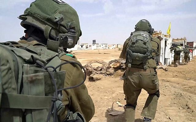 Illustrative: Army cadets simulate a takeover of a Lebanese village at the IDF Officers' Training School, June 2019 (Israel Defense Forces) Illustrative: Army cadets simulate a takeover of a Lebanese village at the IDF Officers' Training School, June 2019 (Israel Defense Forces)
