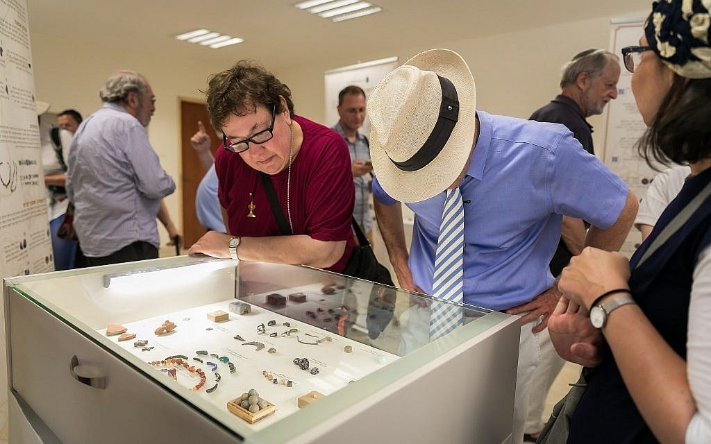 Visitors at an exhibit of notable artifacts discovered in the Temple Mount Sifting Project at a one-day exhibit on June 2, 2019. (Yosef Huri)