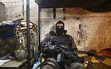 In this May 30, 2019 photo, an actor waits for his scene on the set of the third season of 'Fauda,' set in Gaza and filmed in Tel Aviv (AP Photo/Oded Balilty)