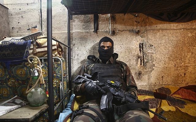 In this May 30, 2019 photo, an actor waits for his scene on the set of the third season of 'Fauda,' set in Gaza and filmed in Tel Aviv (AP Photo/Oded Balilty) In this May 30, 2019 photo, an actor waits for his scene on the set of the third season of 'Fauda,' set in Gaza and filmed in Tel Aviv (AP Photo/Oded Balilty)