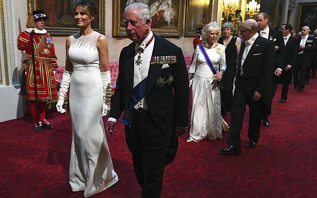 First lady Melania Trump, second left and Britain's Prince Charles arrive through the East Gallery ahead of the State Banquet at Buckingham Palace in London, June 3, 2019. (Victoria Jones/Pool Photo via AP) First lady Melania Trump, second left and Britain's Prince Charles arrive through the East Gallery ahead of the State Banquet at Buckingham Palace in London, June 3, 2019. (Victoria Jones/Pool Photo via AP)